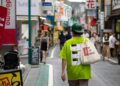 man walking on street during daytime