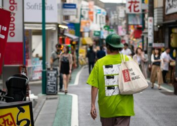 man walking on street during daytime