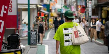man walking on street during daytime