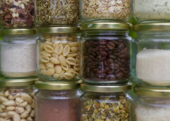 assorted spices in clear glass jars