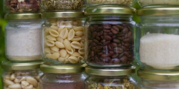 assorted spices in clear glass jars