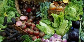 green and red vegetable on brown woven basket